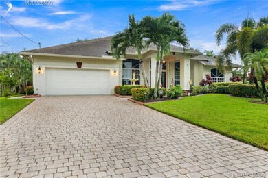 PAVER DRIVEWAY, CEMENT CURBING , FRONT ENTRY TO HO