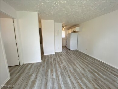 Unfurnished living room featuring light wood finis