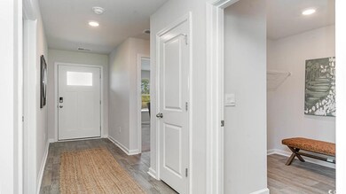 Doorway to outside featuring light hardwood / wood