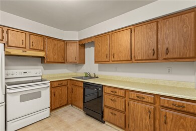 Eat-in-kitchen, abundant storage and neutral decor