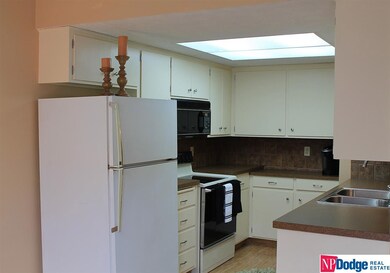 UPDATED KITCHEN COUNTER TOPS, CERAMIC TILE BACKSPLASH, NEWER KITCHEN SINK.