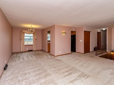 Dining area attached to the living room. Looks out