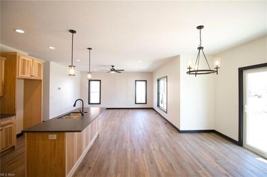 Island with sink and granite countertop