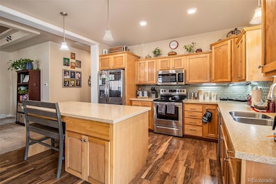 Beautiful kitchen with tons of light, a kitchen island and a pop of color backsplash.