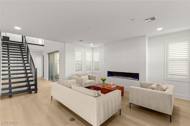 Living room featuring light wood finished floors,