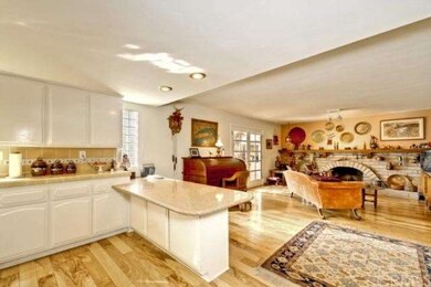 Kitchen eating bar looking into the family room