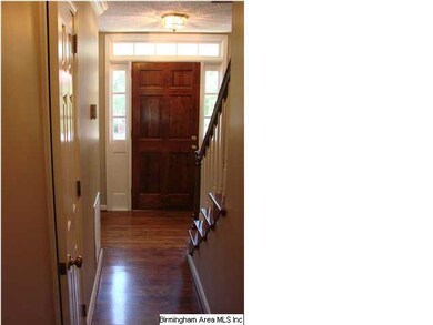 Transom windows surround front entrance.  Gleaming