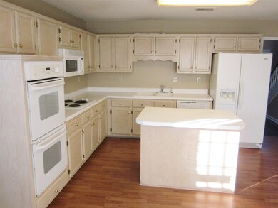 Tons of cabinet space, double oven and island with