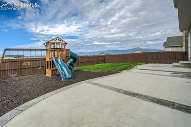 Huge stained and stamped designer concrete patio that connects all the way around the house to the driveway.Childrens playground goes with the home!