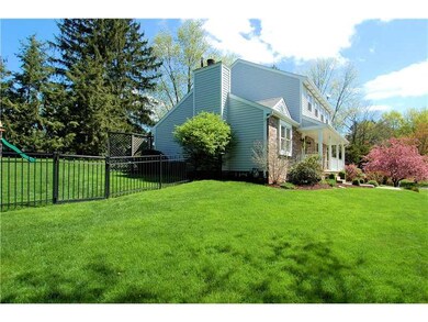 Exterior Front. Lush landscape abounds.  The yard 
