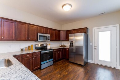 Kitchen with Granite, Tile Backsplash and Full Stainless Steel Appliance Package