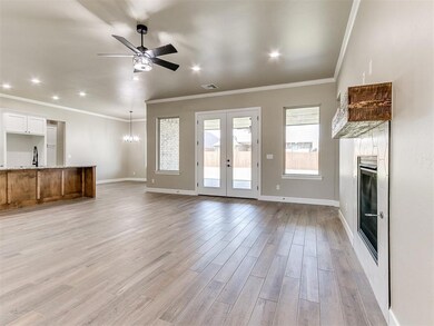 Unfurnished living room with french doors, sink, l