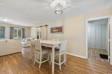 Dining room featuring light wood-type flooring, a 