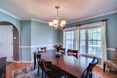 Formal Dining beaming with natural light and punct