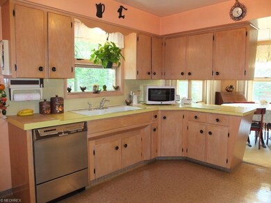 Fully applianced kitchen with Amish made cabinets.