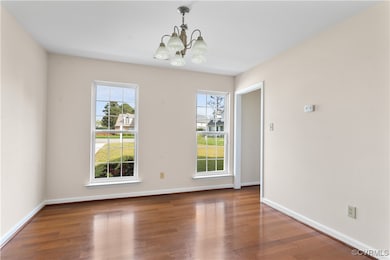 Unfurnished dining area with wood finished floors,