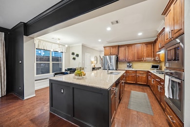 View of the kitchen back toward the entry and dini