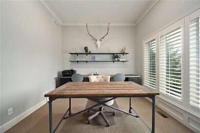 Quiet study with french doors and plantation shutt