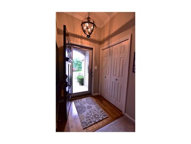 Dramatic entry with large coat closet and hardwood