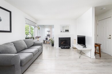 Living Room with Fireplace and Sunroom