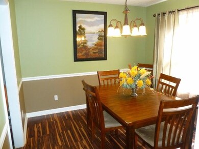 Dining area with chair rail, new floors and lights