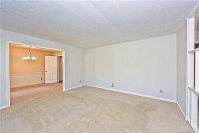 Living Room Opens up to Dining Room