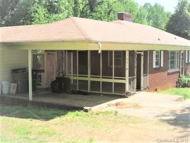 Carport and screened in patio.