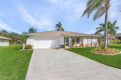 Ranch-style home featuring a garage and a front ya