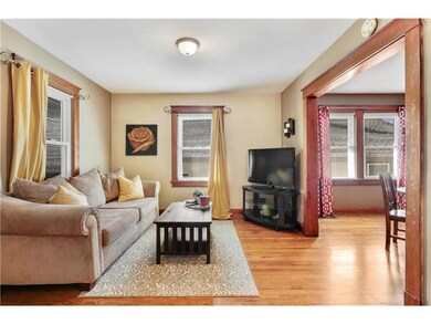 The living room gets great natural light and is op