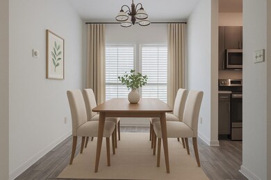 Dining space with a chandelier, wood finished flo