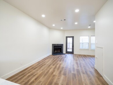 Unfurnished living room featuring light wood-type