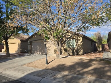View of front of house featuring stucco siding, a
