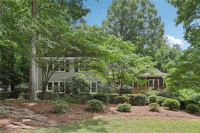 View of property hidden behind natural elements