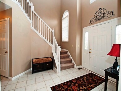 Welcoming two story foyer with ceramic tile floors