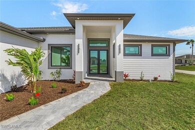 Property entrance with a shingled roof, stucco sid