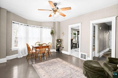 Dining room featuring ceiling fan and hardwood / w