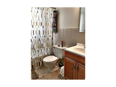 Updated tile floor. Shower over tub.