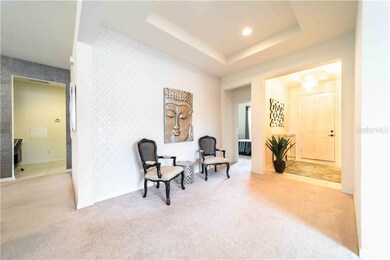 FOYER AND LOUNGE AREA decorated with matching wall