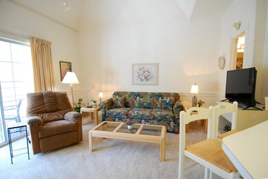 Living area featuring carpet flooring