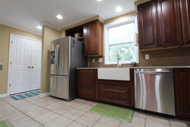 All appliances remain! Quartz countertops! Notice the farm style sink which the seller says is wonderful. Extra closet to right of refrigerator beside door to deck. This is in addition to walk in pantry. 