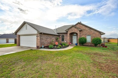 Single story home with a front lawn and a garage