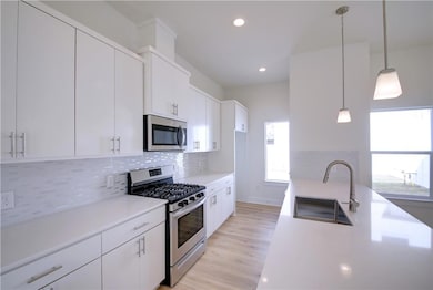 Kitchen featuring appliances with stainless steel