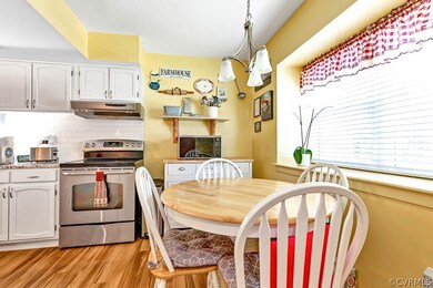 Dining space with light hardwood / wood-style floo