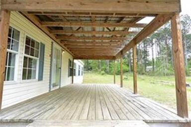 THE COVERED FRONT DECK IS 22X12 SQ. FT. AND A GREA