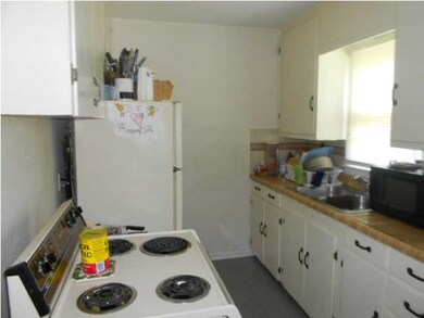 Kitchen with window over sink to view fenced backy