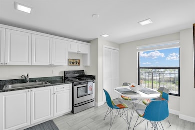 Roomy eat in kitchen (washer and dryer in that clo