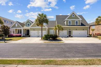 View of front of property featuring driveway, an a