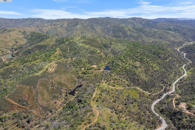 Aerial photo of house, 2 ponds, ranch roads, olive orchard, Mines Rd and surrounding terrain