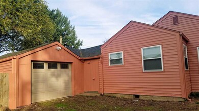 Full NW side closeup with garage.