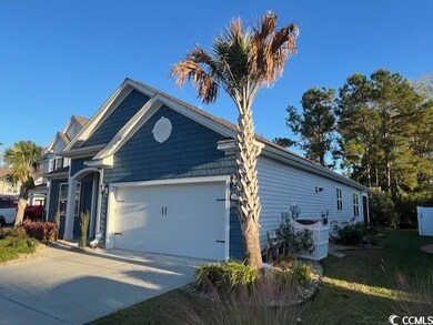 View of property exterior featuring a garage and c